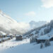 Scenic view of a Swiss ski resort surrounded by snow-covered mountains.